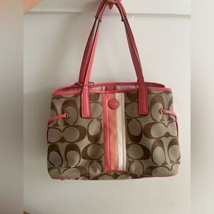Coach purse brown with pink accent stripe and side rope